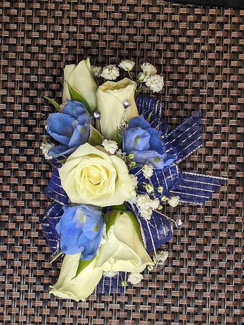 Blue and white corsage