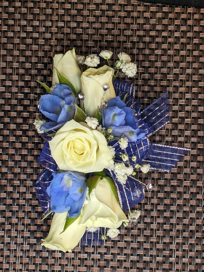 Blue and white corsage